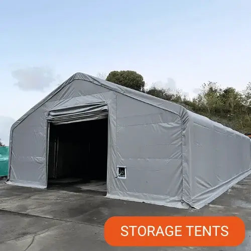 Gray PVC storage tent with open entrance on a clear day