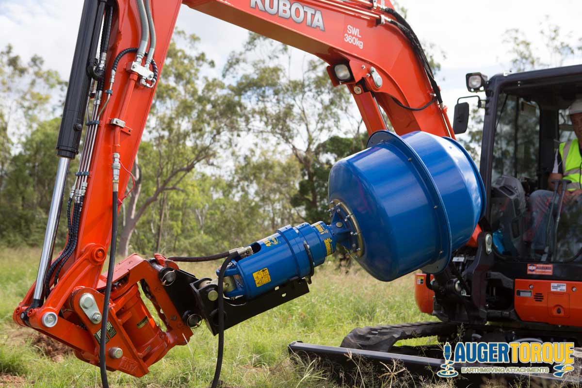 Auger Torque Cement Mixer Bowl for Earth Drills attached to a Kubota excavator mixing cement on-site.