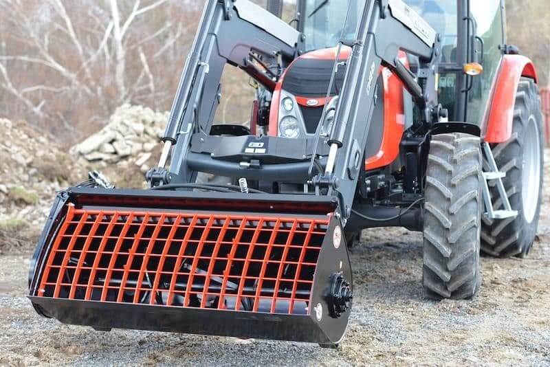 Kovaco - Concrete Mixing Bucket attachment attached to a tractor, designed for efficient concrete production in tough terrain.